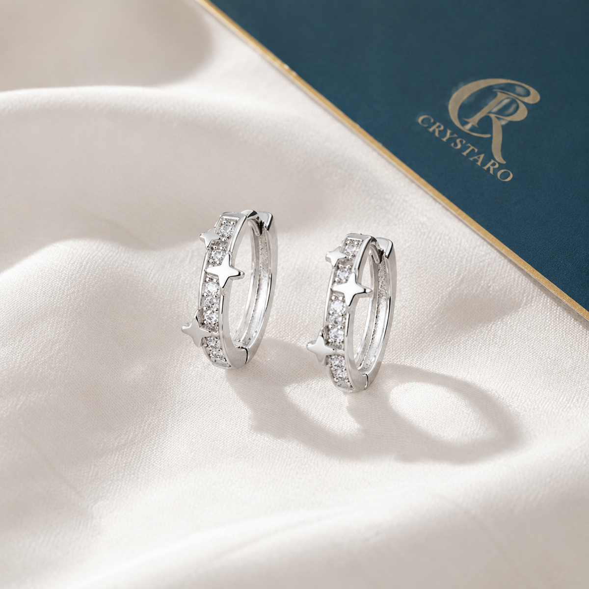 Silver-Tone Pave Huggie Hoop Earrings — styled product still life — CRYSTARO