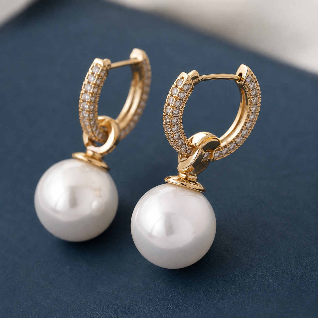 Pearl Drop Huggie Earrings — craftsmanship close-up — CRYSTARO