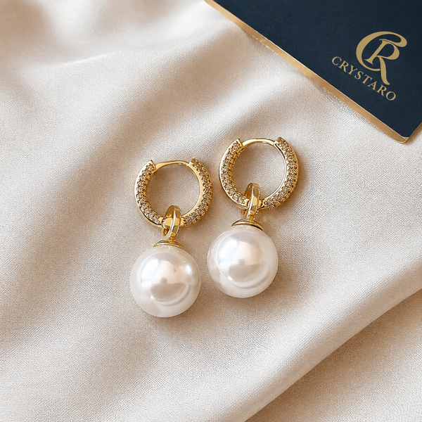 Pearl Drop Huggie Earrings — styled product still life — CRYSTARO