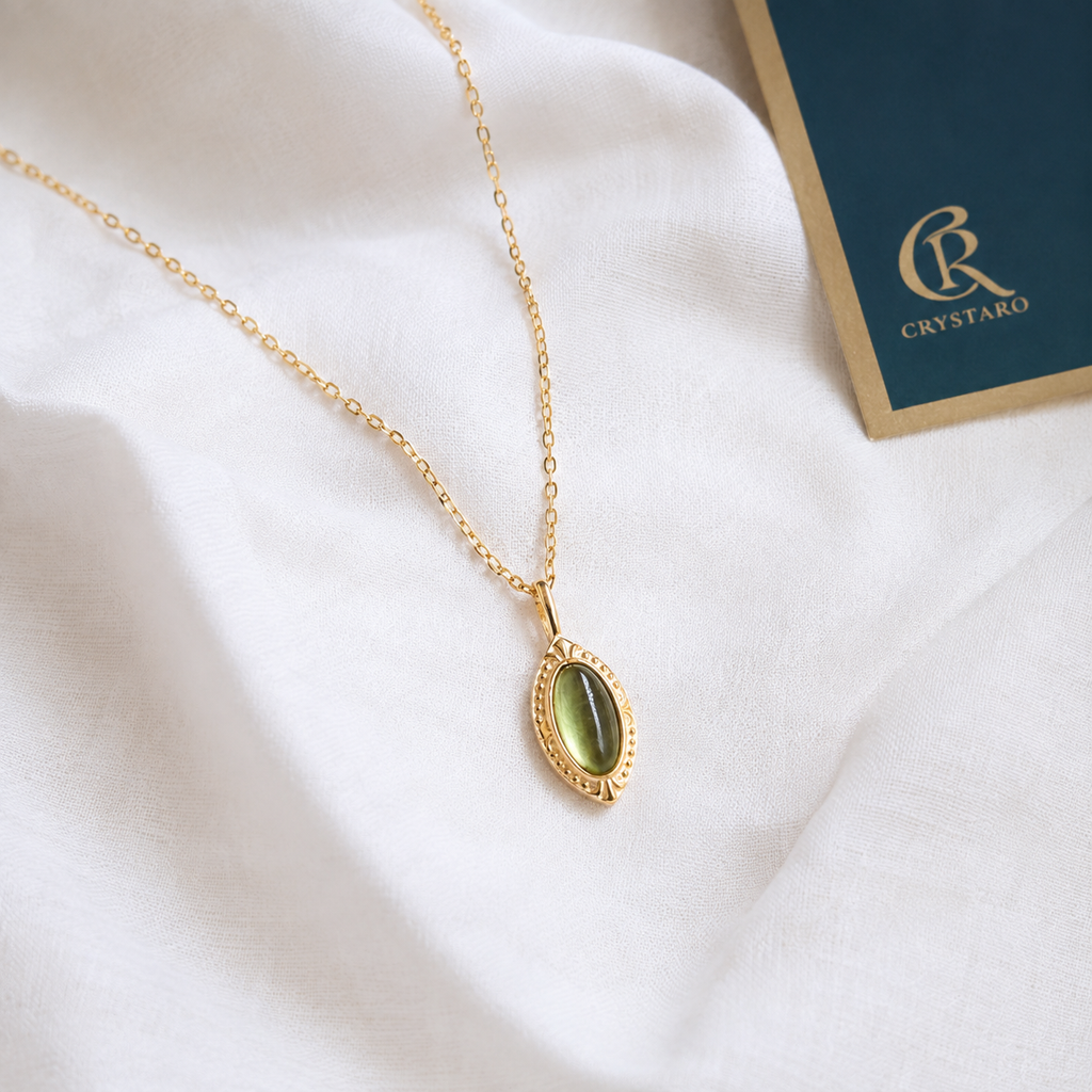 Vintage Green Oval Crystal Pendant Necklace — styled product still life — CRYSTARO