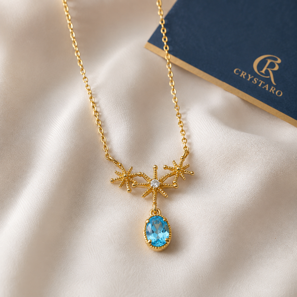 Blue Starburst Pendant Necklace — styled product still life — CRYSTARO